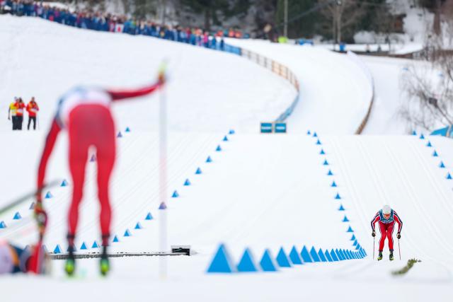 (260221) -- TESERO, Feb. 21, 2026 (Xinhua) -- Emil Iversen (R) of Norway sprints toward the finish line during the cross-country skiing men's 50km mass start classic match at the Milan-Cortina 2026 Olympic Winter Games in Tesero, Italy, Feb. 21, 2026. (Xinhua/Huang Wei)