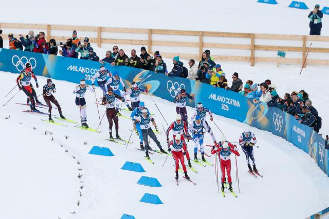 (260221) -- TESERO, Feb. 21, 2026 (Xinhua) -- Athletes compete during the cross-country skiing men's 50km mass start classic match at the Milan-Cortina 2026 Olympic Winter Games in Tesero, Italy, Feb. 21, 2026. (Xinhua/Huang Wei)
