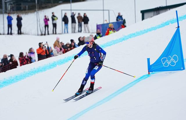 (260221) -- BORMIO, Feb. 21, 2026 (Xinhua) -- Emily Harrop of France competes during the ski mountaineering mixed relay event at the Milan-Cortina 2026 Olympic Winter Games in Bormio, Italy, Feb. 21, 2026. (Xinhua/Yan Linyun)