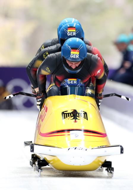 (260221) -- CORTINA D'AMPEZZO, Feb. 21, 2026 (Xinhua) -- Francesco Friedrich/Matthias Sommer/Alexander Schuller/Felix Straub of Germany compete during the Bobsleigh 4-man heat 2 at the 2026 Milan-Cortina Winter Olympics in Cortina D'Ampezzo, Italy, Feb. 21, 2026. (Xinhua/Ding Xu)