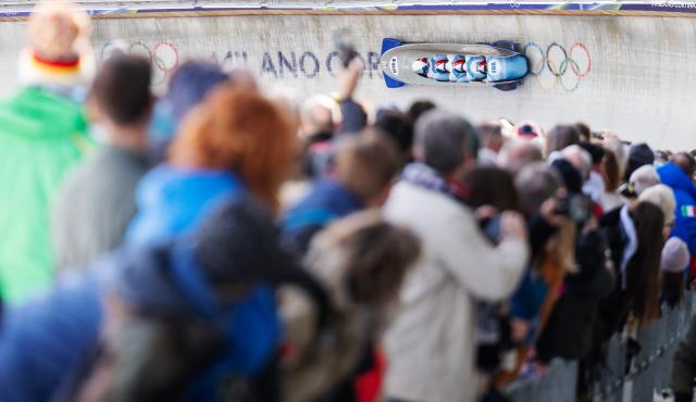 (260221) -- CORTINA D'AMPEZZO, Feb. 21, 2026 (Xinhua) -- Romain Heinrich/Dorian Hauterville/Nils Blairon/Antoine Riou of France compete during the Bobsleigh 4-man heats at the 2026 Milan-Cortina Winter Olympics in Cortina D'Ampezzo, Italy, Feb. 21, 2026. (Xinhua/Fei Maohua)
