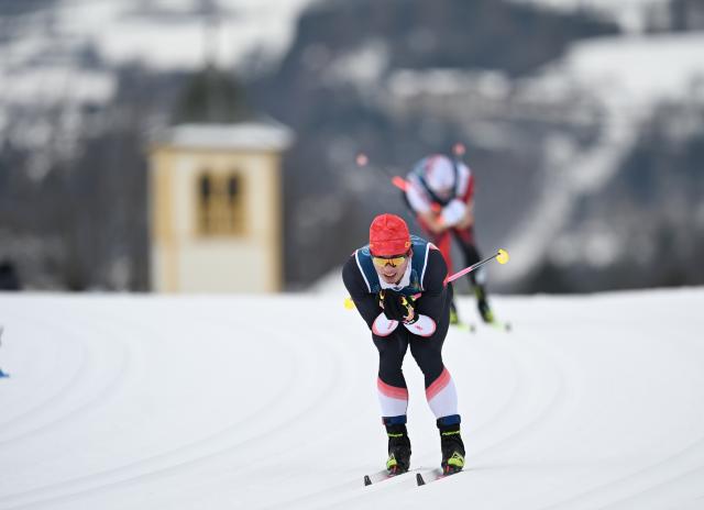 (260221) -- TESERO, Feb. 21, 2026 (Xinhua) -- Li Minglin of China competes during the cross-country skiing men's 50km mass start classic match at the Milan-Cortina 2026 Olympic Winter Games in Tesero, Italy, Feb. 21, 2026. (Xinhua/He Canling)
