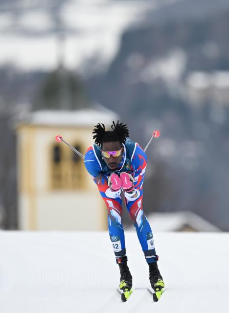 (260221) -- TESERO, Feb. 21, 2026 (Xinhua) -- Stevenson Savart of Haiti competes during the cross-country skiing men's 50km mass start classic match at the Milan-Cortina 2026 Olympic Winter Games in Tesero, Italy, Feb. 21, 2026. (Xinhua/He Canling)