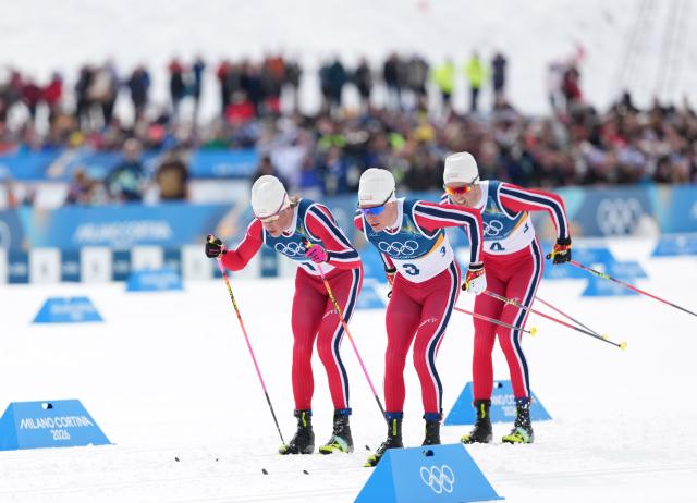 (260221) -- TESERO, Feb. 21, 2026 (Xinhua) -- Johannes Hoesflot Klaebo (L), Martin Loewstroem Nyenget (C) and Emil Iversen of Norway compete during the cross-country skiing men's 50km mass start classic match at the Milan-Cortina 2026 Olympic Winter Games in Tesero, Italy, Feb. 21, 2026. (Xinhua/Meng Yongmin)