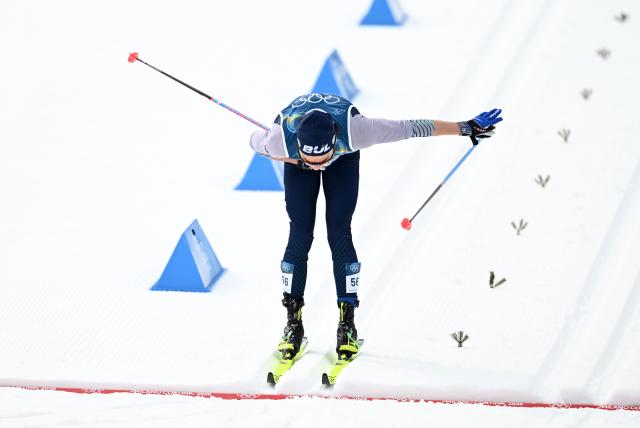 (260221) -- TESERO, Feb. 21, 2026 (Xinhua) -- Daniel Peshkov Bulgaria crosses the finish line during the cross-country skiing men's 50km mass start classic match at the Milan-Cortina 2026 Olympic Winter Games in Tesero, Italy, Feb. 21, 2026. (Xinhua/He Canling)