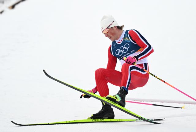 (260221) -- TESERO, Feb. 21, 2026 (Xinhua) -- Johannes Hoesflot Klaebo of Norway reacts after the cross-country skiing men's 50km mass start classic match at the Milan-Cortina 2026 Olympic Winter Games in Tesero, Italy, Feb. 21, 2026. (Xinhua/He Canling)