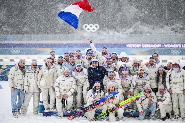 (260221) -- ANTERSELVA, Feb. 21, 2026 (Xinhua) -- Members of Team France pose for photos during the awarding ceremony of the biathlon women's 12.5km mass start event at the 2026 Milan-Cortina Winter Olympics in Anterselva, Italy, Feb. 21, 2026. (Xinhua/Jiang Han)