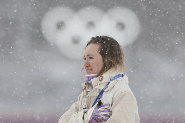 (260221) -- ANTERSELVA, Feb. 21, 2026 (Xinhua) -- Gold medalists Oceane Michelon of France weeps during the awarding ceremony of the biathlon women's 12.5km mass start event at the 2026 Milan-Cortina Winter Olympics in Anterselva, Italy, Feb. 21, 2026. (Xinhua/Zhang Tao)