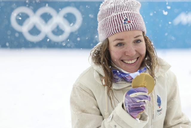 (260221) -- ANTERSELVA, Feb. 21, 2026 (Xinhua) -- Gold medalists Oceane Michelon of France celebrates after the awarding ceremony of the biathlon women's 12.5km mass start event at the 2026 Milan-Cortina Winter Olympics in Anterselva, Italy, Feb. 21, 2026. (Xinhua/Zhang Tao)
