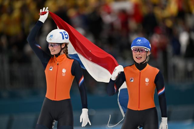 (260221) -- MILAN, Feb. 21, 2026 (Xinhua) -- Marijke Groenewoud (R) of the Netherlands and her teammate Bente Kerkhoff celebrate after the speed skating women's mass start final at the Milan-Cortina 2026 Olympic Winter Games in Milan, Italy, Feb. 21, 2026. (Xinhua/Wu Wei)