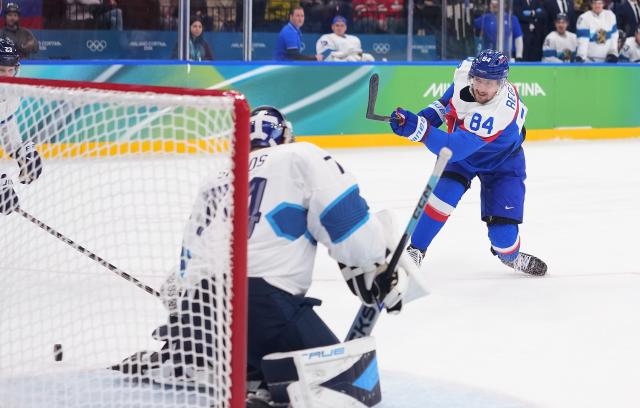 (260221) -- MILAN, Feb. 21, 2026 (Xinhua) -- Pavol Regenda of Slovakia shoots during the ice hockey men's bronze medal game between Slovakia and Finland at the Milan-Cortina 2026 Olympic Winter Games in Milan, Italy, Feb. 21, 2026. (Xinhua/Tao Xiyi)