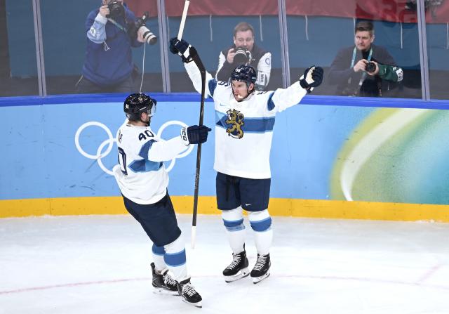(260221) -- MILAN, Feb. 21, 2026 (Xinhua) -- Joel Armia (L) and Erik Haula of Finland celebrate scoring during the ice hockey men's bronze medal game between Slovakia and Finland at the Milan-Cortina 2026 Olympic Winter Games in Milan, Italy, Feb. 21, 2026. (Xinhua/Zhang Haofu)
