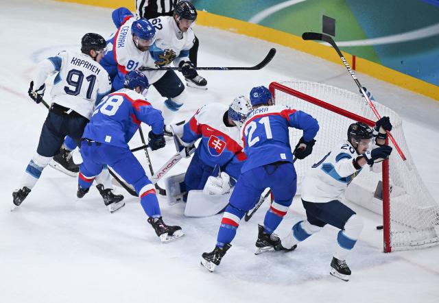 (260221) -- MILAN, Feb. 21, 2026 (Xinhua) -- Sebastian Aho (1st R) of Finland scores during the ice hockey men's bronze medal game between Slovakia and Finland at the Milan-Cortina 2026 Olympic Winter Games in Milan, Italy, Feb. 21, 2026. (Xinhua/Zhang Haofu)