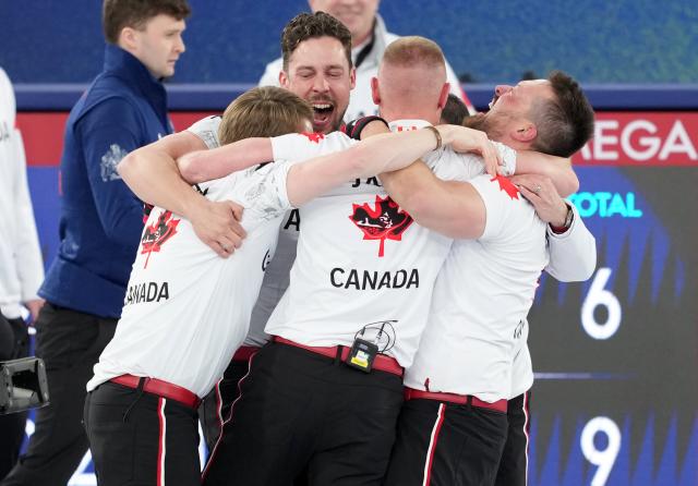 (260221) -- CORTINA D'AMPEZZO, Feb. 21, 2026 (Xinhua) -- Players of Canada celebrate after the curling men's gold medal game between Canada and Britain at the 2026 Milan-Cortina Winter Olympics in Cortina, Italy, Feb. 21, 2026. (Xinhua/Li Gang)