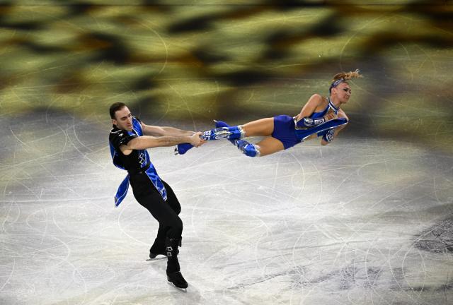 (260222) -- MILAN, Feb. 22, 2026 (Xinhua) -- Anastasiia Metelkina (R)/Luka Berulava of Georgia perform during the gala exhibition of figure skating at the Milan-Cortina 2026 Olympic Winter Games in Milan, Italy, Feb. 21, 2026. (Xinhua/Cheng Min)