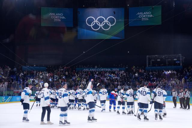 (260222) -- MILAN, Feb. 22, 2026 (Xinhua) -- Players of Finland celebrate after winning the ice hockey men's bronze medal game between Slovakia and Finland at the Milan-Cortina 2026 Olympic Winter Games in Milan, Italy, Feb. 21, 2026. (Xinhua/Tao Xiyi)