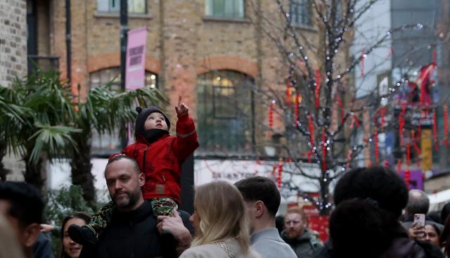 (260222) -- LONDON, Feb. 22, 2026 (Xinhua) -- A child is pictured during a Chinese New Year celebration at Camden Market in London, Britain, Feb. 21, 2026. (Xinhua/Li Ying)