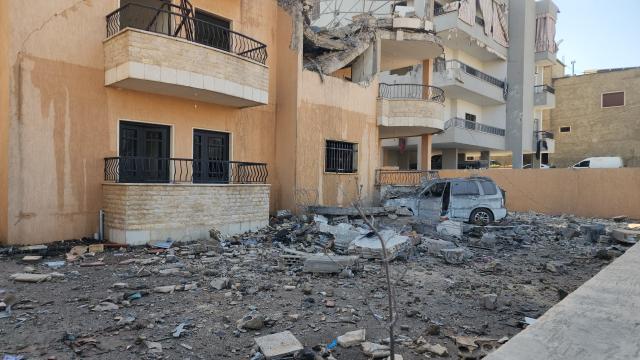 (260222) -- RIYAQ, Feb. 22, 2026 (Xinhua) -- This photo taken on Feb. 21, 2026 shows buildings destroyed by Israeli airstrikes in Riyaq, eastern Lebanon. Three commanders from the Lebanese Hezbollah group and eight others were killed, with 35 more were injured, in a series of Israeli airstrikes on eastern Lebanon on Friday, according to official and Lebanese security sources. (Photo by Taher Abu Hamdan/Xinhua)