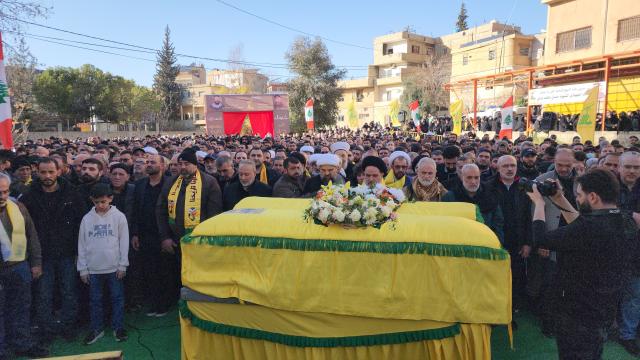 (260222) -- RIYAQ, Feb. 22, 2026 (Xinhua) -- People attend a funeral of Hezbollah fighters and civilians killed in Israeli airstrikes in Riyaq, eastern Lebanon, Feb. 21, 2026. Three commanders from the Lebanese Hezbollah group and eight others were killed, with 35 more were injured, in a series of Israeli airstrikes on eastern Lebanon on Friday, according to official and Lebanese security sources. (Photo by Taher Abu Hamdan/Xinhua)