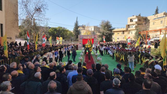 (260222) -- RIYAQ, Feb. 22, 2026 (Xinhua) -- People attend a funeral of Hezbollah fighters and civilians killed in Israeli airstrikes in Riyaq, eastern Lebanon, Feb. 21, 2026. Three commanders from the Lebanese Hezbollah group and eight others were killed, with 35 more were injured, in a series of Israeli airstrikes on eastern Lebanon on Friday, according to official and Lebanese security sources. (Photo by Taher Abu Hamdan/Xinhua)