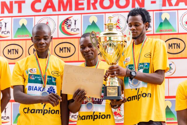 (260222) -- BUEA, Feb. 22, 2026 (Xinhua) -- Winners of the relay category pose with their trophy during the awarding ceremony for the 31st edition of the Mount Cameroon Race in Buea, Cameroon, Feb. 21, 2026. The race opened under the theme "Give peace a chance", drawing 600 athletes from 14 countries and regions. (Photo by Muleng Timngum/Xinhua)
