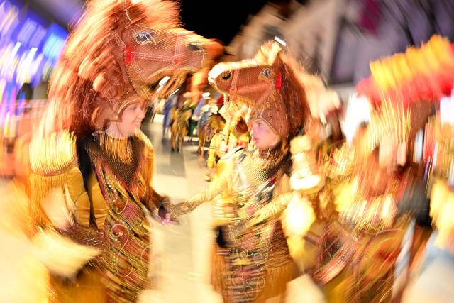 (260222) -- STRUMICA, Feb. 22, 2026 (Xinhua) -- Costumed revelers perform in an evening carnival in Strumica, North Macedonia, Feb. 21, 2026. (Photo by Tomislav Georgiev/Xinhua)