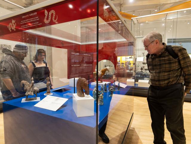 (260222) -- TORONTO, Feb. 22, 2026 (Xinhua) -- Visitors view exhibits of the Year of the Horse from the Chinese Zodiac Case exhibition at the Royal Ontario Museum in Toronto, Canada, on Feb. 21, 2026. Featuring a rich collection of horse-themed objects and cultural artifacts, this annual Chinese zodiac exhibition opened here on Feb. 10 and will last until Jan. 31, 2027. (Photo by Zou Zheng/Xinhua)