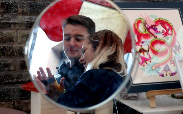 (260222) -- BEIJING, Feb. 22, 2026 (Xinhua) -- People attend a Chinese New Year celebration at Camden Market in London, Britain, Feb. 21, 2026. (Xinhua/Li Ying)