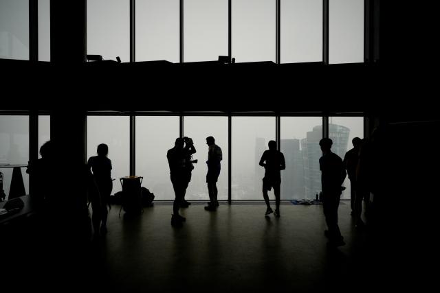 (260222) -- WARSAW, Feb. 22, 2026 (Xinhua) -- Participants rest on a high floor inside the Skyliner building during the Skyliner Everest Run 2026 in Warsaw, Poland on Feb. 21, 2026. The event requires competitors to ascend the 42-floor staircase 55 times within 24 hours, reaching a cumulative height equivalent to the world's highest peak, Mount Qomolangma. (Photo by Jaap Arriens/Xinhua)
