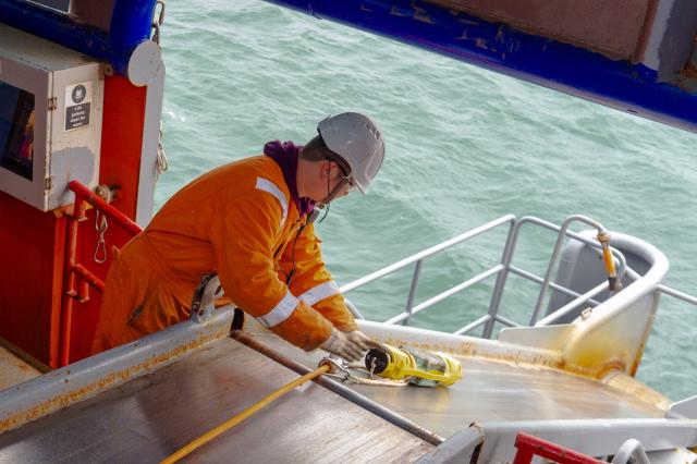 (260222) -- BAKU, Feb. 22, 2026 (Xinhua) -- A Chinese technician demonstrates offshore operations on a node-laying vessel at the Baku Shipyard in Baku, Azerbaijan, Feb. 10, 2026. TO GO WITH "Feature: 'Caspian' Spring Festival for Chinese oil explorers supporting Azerbaijan's energy exploration" (Xinhua/Chen Junfeng)