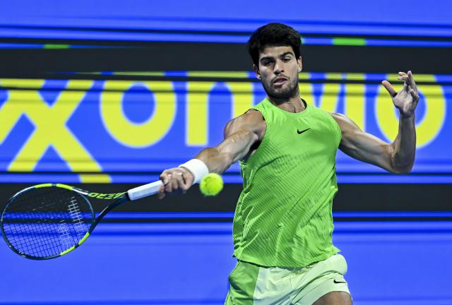 (260222) -- DOHA, Feb. 22, 2026 (Xinhua) -- Carlos Alcaraz hits a return during the men's singles final match between Carlos Alcaraz of Spain and Arthur Fils of France at the ATP Qatar Open 2026 tennis tournament final in Doha, Qatar, on Feb. 21, 2026. (Photo by Nikku/Xinhua)