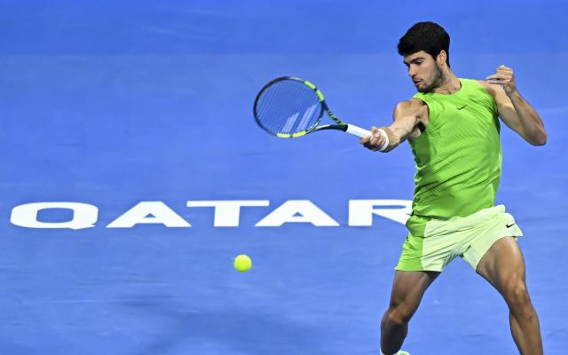 (260222) -- DOHA, Feb. 22, 2026 (Xinhua) -- Carlos Alcaraz hits a return during the men's singles final match between Carlos Alcaraz of Spain and Arthur Fils of France at the ATP Qatar Open 2026 tennis tournament final in Doha, Qatar, on Feb. 21, 2026. (Photo by Nikku/Xinhua)