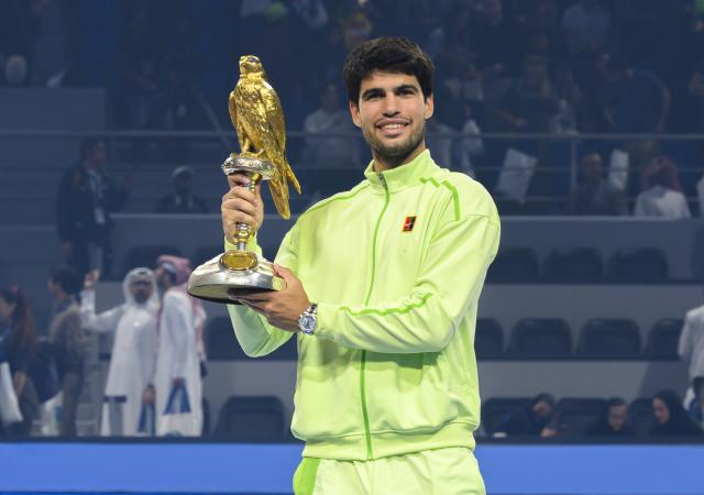 (260222) -- DOHA, Feb. 22, 2026 (Xinhua) -- Champion Carlos Alcaraz poses with the trophy during the awarding ceremony after the men's singles final match between Carlos Alcaraz of Spain and Arthur Fils of France at the ATP Qatar Open 2026 tennis tournament final in Doha, Qatar, on Feb. 21, 2026. (Photo by Nikku/Xinhua)