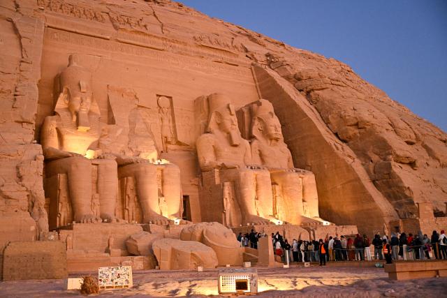 (260222) -- ASWAN, Feb. 22, 2026 (Xinhua) -- Tourists wait for entering the Great Temple of Abu Simbel during the Sun Festival in Aswan, Egypt, Feb. 22, 2026. During the Sun Festival, which falls on Feb. 22 and Oct. 22 every year, rays of the morning sun would reach the innermost shrine of the Great Temple of Abu Simbel and illuminate the inside sculptures. (Xinhua/Xin Mengchen)
