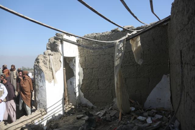 (260222) -- NANGARHAR, Feb. 22, 2026 (Xinhua) -- Local residents check a damaged house following an airstrike in Afghanistan's Nangarhar Province, on Feb. 22, 2026. Zabihullah Mujahid, spokesperson for the Afghan government, confirmed on X on Sunday that the Pakistani military had once again carried out airstrikes on border areas between Afghanistan and Pakistan, causing dozens of casualties. (Photo by Saifurahman Safi/Xinhua)