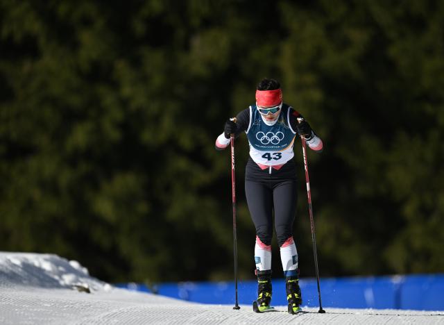 (260222) -- TESERO, Feb. 22, 2026 (Xinhua) -- Wang Yundi of China competes during the cross-country skiing women's 50km mass start classic match at the Milan-Cortina 2026 Olympic Winter Games in Tesero, Italy, Feb. 22, 2026. (Xinhua/He Canling)