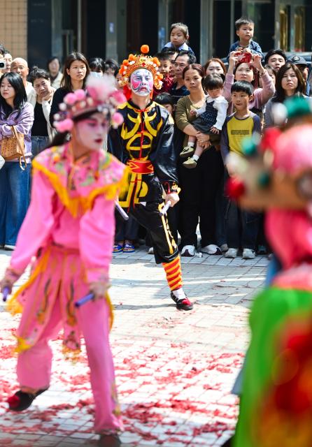(260222) -- PUNING, Feb. 22, 2026 (Xinhua) -- Artists perform Yingge dance in Puning, south China's Guangdong Province, Feb. 22, 2026. The Yingge dance, or "dance to the hero's song," is a folk dance of south China's Guangdong Province which has enjoyed growing popularity nationwide in recent years. As many shops in Puning chose to open their doors to start the new year's business on Sunday, the sixth day of the Chinese New Year, Yingge dance teams staged wonderful performances across the city to convey their best wishes for a prosperous start of the new year. (Xinhua/Chen Yehua)