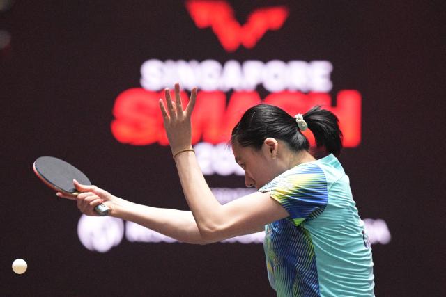 (260222) -- SINGAPORE, Feb. 22, 2026 (Xinhua) -- Chen Yi hits a return during the women's singles round of 64 match between Chen Yi of China and Sofia Polcanova of Austria at the World Table Tennis (WTT) Singapore Smash 2026 in Singapore on Feb. 22, 2026. (Photo by Then Chih Wey/Xinhua)