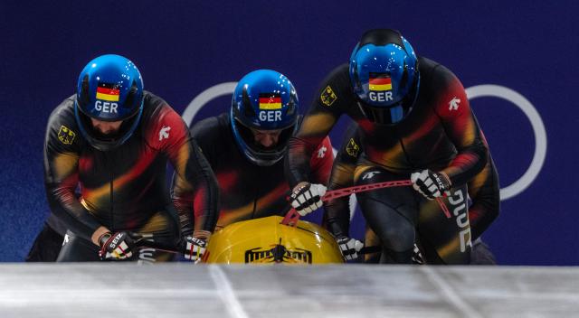 (260222) -- CORTINA D'AMPEZZO, Feb. 22, 2026 (Xinhua) -- Johannes Lochner/Thorsten Margis/Jorn Wenzel/Georg Fleischhauer of Germany compete during the Bobsleigh 4-man heat 3 at the 2026 Milan-Cortina Winter Olympics in Cortina D'Ampezzo, Italy, Feb. 22, 2026. (Xinhua/Fei Maohua)