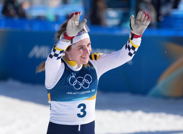 (260222) -- TESERO, Feb. 22, 2026 (Xinhua) -- Ebba Andersson of Sweden celebrates winning after finishing the cross-country skiing women's 50km mass start classic match at the Milan-Cortina 2026 Olympic Winter Games in Tesero, Italy, Feb. 22, 2026. (Xinhua/Meng Yongmin)