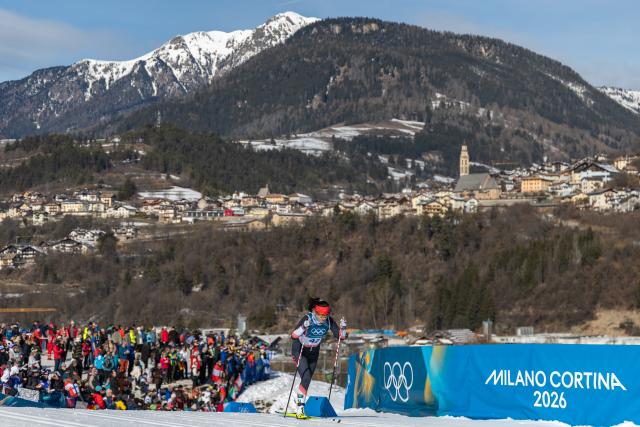 (260222) -- TESERO, Feb. 22, 2026 (Xinhua) -- Dinigeer Yilamujiang of China competes during the cross-country skiing women's 50km mass start classic match at the Milan-Cortina 2026 Olympic Winter Games in Tesero, Italy, Feb. 22, 2026. (Xinhua/Huang Wei)