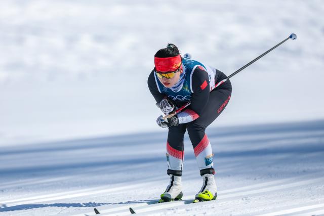 (260222) -- TESERO, Feb. 22, 2026 (Xinhua) -- Dinigeer Yilamujiang of China competes during the cross-country skiing women's 50km mass start classic match at the Milan-Cortina 2026 Olympic Winter Games in Tesero, Italy, Feb. 22, 2026. (Xinhua/Huang Wei)