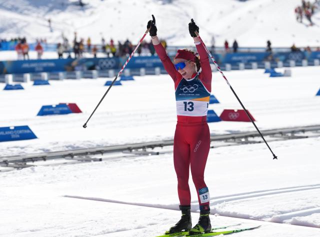 (260222) -- TESERO, Feb. 22, 2026 (Xinhua) -- Nadja Kaelin of Switzerland celebrates after crossing the finish line during the cross-country skiing women's 50km mass start classic match at the Milan-Cortina 2026 Olympic Winter Games in Tesero, Italy, Feb. 22, 2026. (Xinhua/Meng Yongmin)