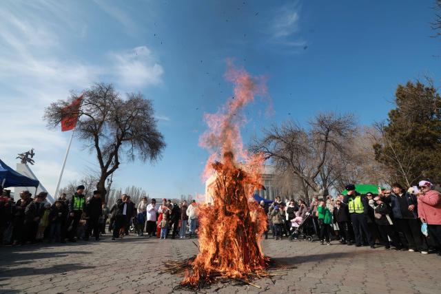 (260222) -- BISHKEK, Feb. 22, 2026 (Xinhua) -- People burn a scarecrow during Maslenitsa celebrations in Bishkek, Kyrgyzstan, on Feb. 22, 2026. Maslenitsa is a traditional holiday to celebrate the beginning of spring. (Photo by Roman/Xinhua)