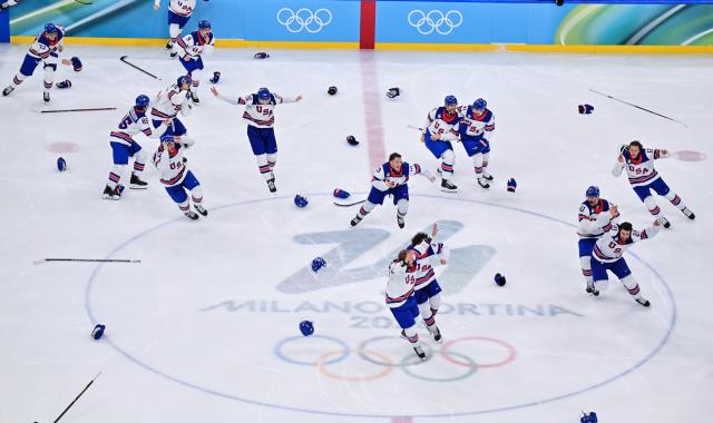 (260222) -- MILAN, Feb. 22, 2026 (Xinhua) -- Players of the United States celebrates after the ice hockey men's gold medal game between Canada and the United States at the Milan-Cortina 2026 Olympic Winter Games in Milan, Italy, Feb. 22, 2026. (Xinhua/Tao Xiyi)