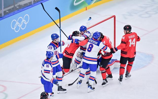 (260222) -- MILAN, Feb. 22, 2026 (Xinhua) -- Players fight during the ice hockey men's gold medal game between Canada and the United States at the Milan-Cortina 2026 Olympic Winter Games in Milan, Italy, Feb. 22, 2026. (Xinhua/Tao Xiyi)