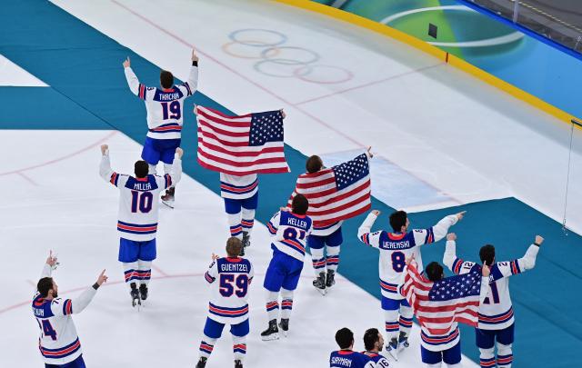 (260222) -- MILAN, Feb. 22, 2026 (Xinhua) -- Players of the United States celebrate after the ice hockey men's gold medal game between Canada and the United States at the Milan-Cortina 2026 Olympic Winter Games in Milan, Italy, Feb. 22, 2026. (Xinhua/Tao Xiyi)
