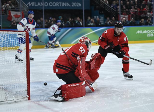 (260222) -- MILAN, Feb. 22, 2026 (Xinhua) -- Goalkeeper Jordan Binnington of Canada fails to make a save during the ice hockey men's gold medal game between Canada and the United States at the Milan-Cortina 2026 Olympic Winter Games in Milan, Italy, Feb. 22, 2026. (Xinhua/Zhang Haofu)