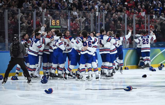 (260222) -- MILAN, Feb. 22, 2026 (Xinhua) -- Players of the United States celebrate victory after the ice hockey men's gold medal game between Canada and the United States at the Milan-Cortina 2026 Olympic Winter Games in Milan, Italy, Feb. 22, 2026. (Xinhua/Zhang Haofu)