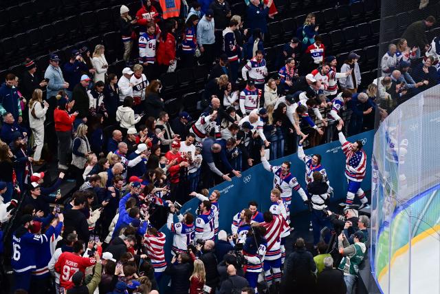 (260222) -- MILAN, Feb. 22, 2026 (Xinhua) -- Players of the United States interact with spectators after the ice hockey men's gold medal game between Canada and the United States at the Milan-Cortina 2026 Olympic Winter Games in Milan, Italy, Feb. 22, 2026. (Xinhua/Tao Xiyi)